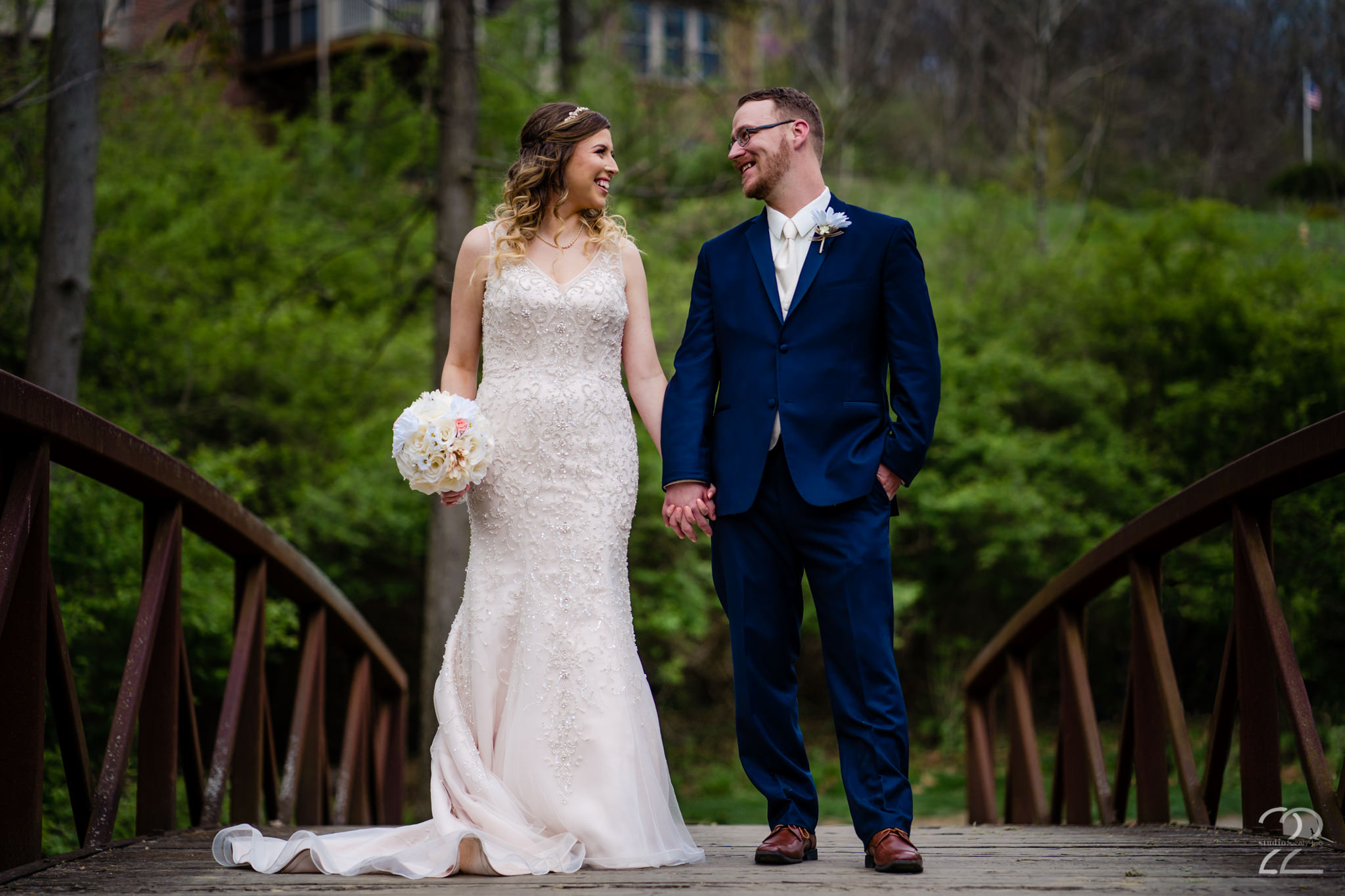  Nick and Erica chose to get married at Aston Oaks Golf Club in Cincinnati, Ohio on a warm spring day. Doing their first look on a beautiful bridge alongside one of Aston Oaks